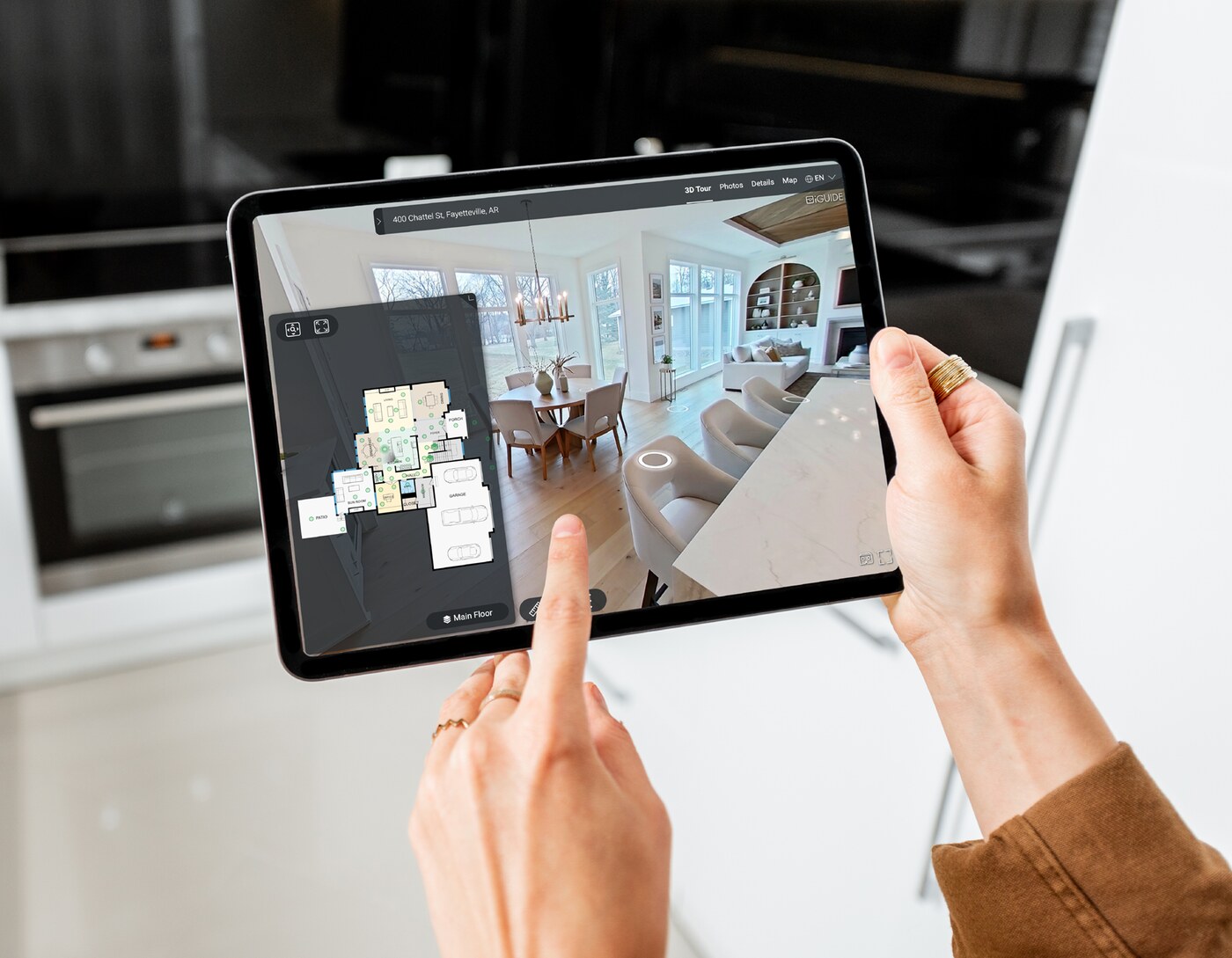 Realtor exploring an iGUIDE 3D virtual tour on iPad
